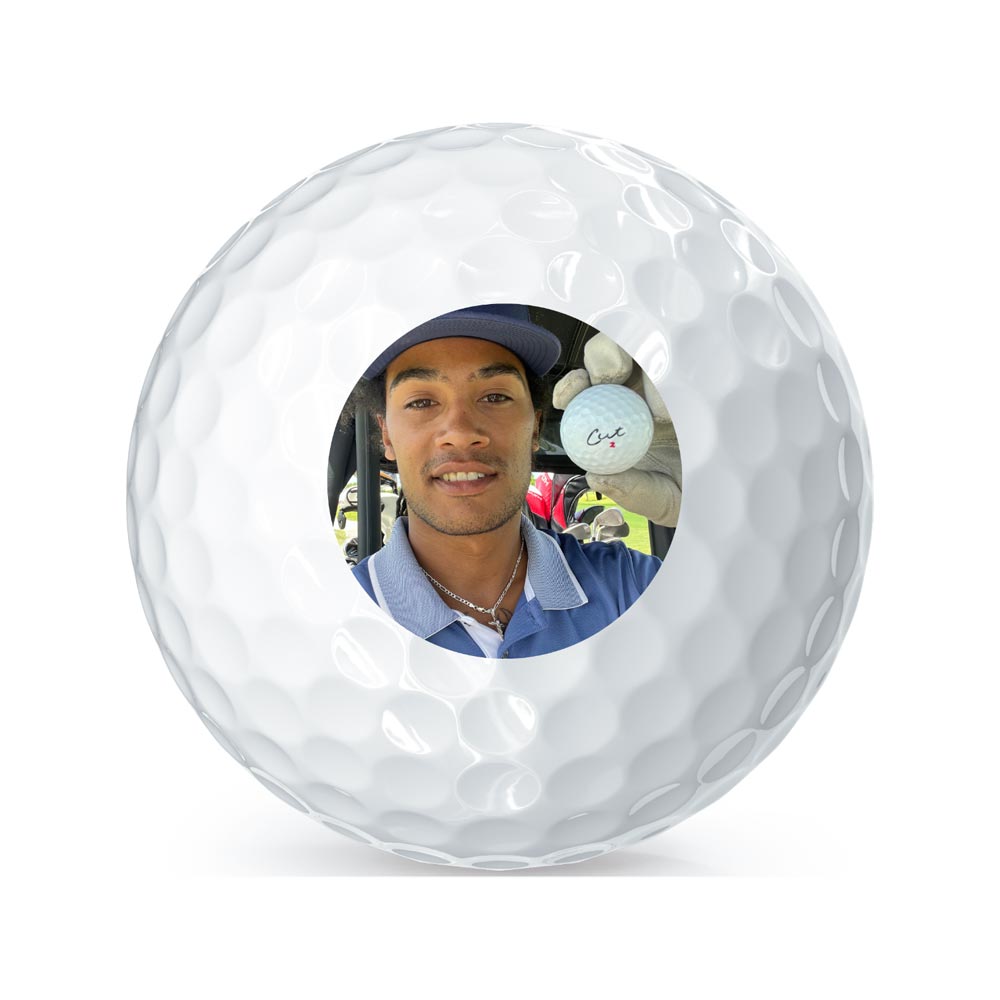 Logo Image of Golfer Holding His Ball  on a Golf Ball